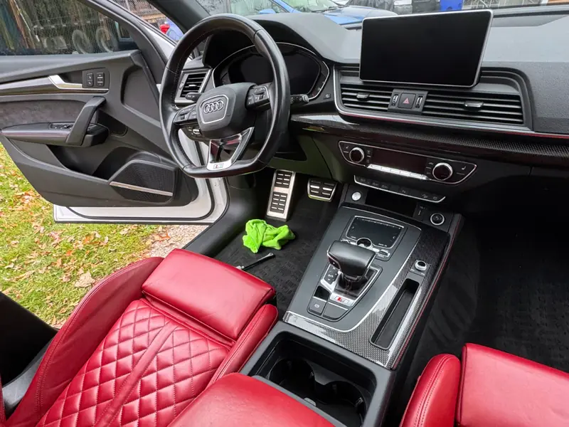 Audi red leather interior - complete detail of dashboard and seats