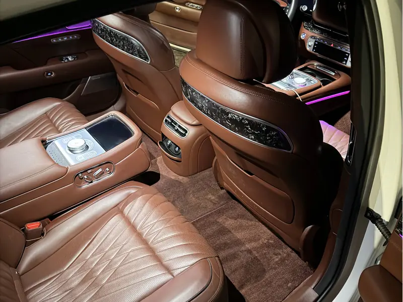 Bentley rear seats passenger side with purple ambient lighting - premium interior detailing