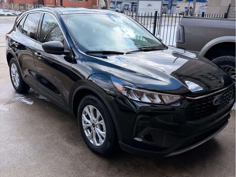 Black Ford exterior passenger angle after professional detailing