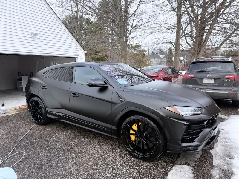 Black Lamborghini SUV passenger angle - premium exterior detailing service