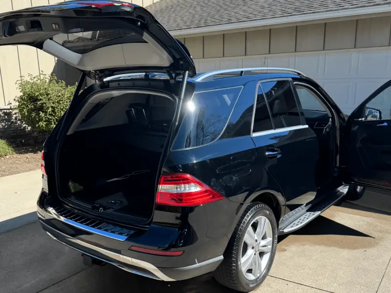 Black SUV detailed interior and exterior - trunk and door open view