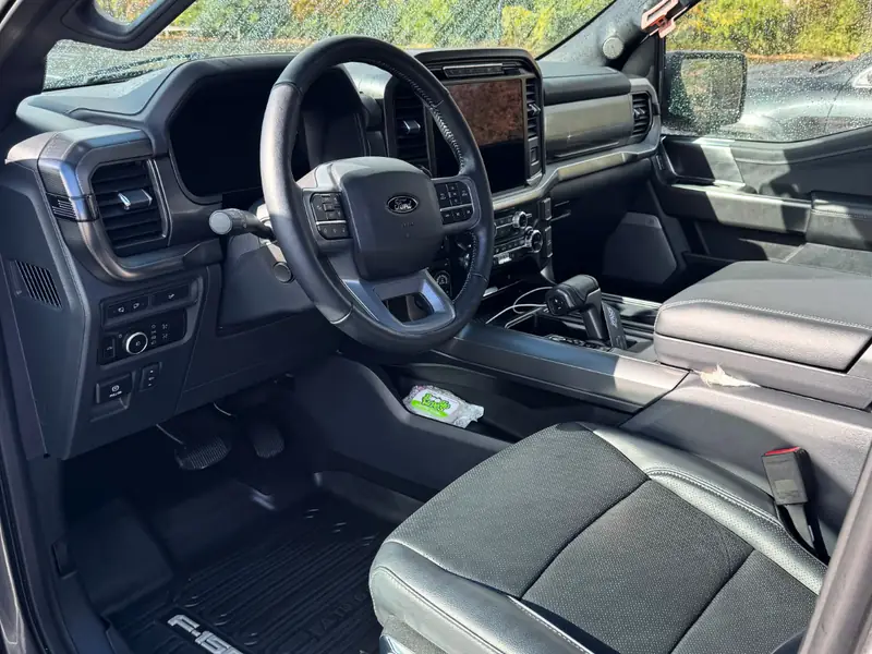 Ford interior driver side - dashboard, seat, and floor mat detail