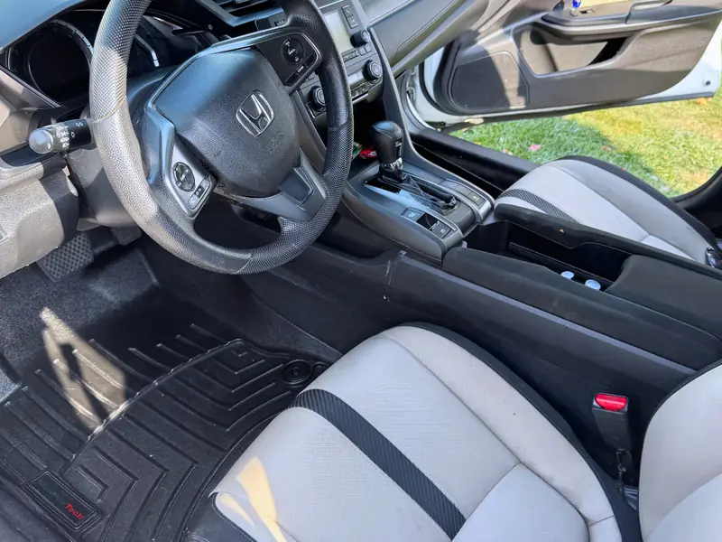 Honda interior after full detail - seats, mats, and dashboard restored
