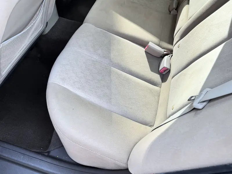 Sedan rear seats and floor mats after deep cleaning service