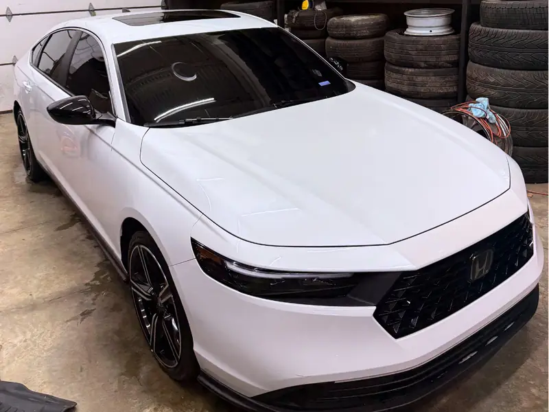 White Honda passenger side exterior after complete detail service